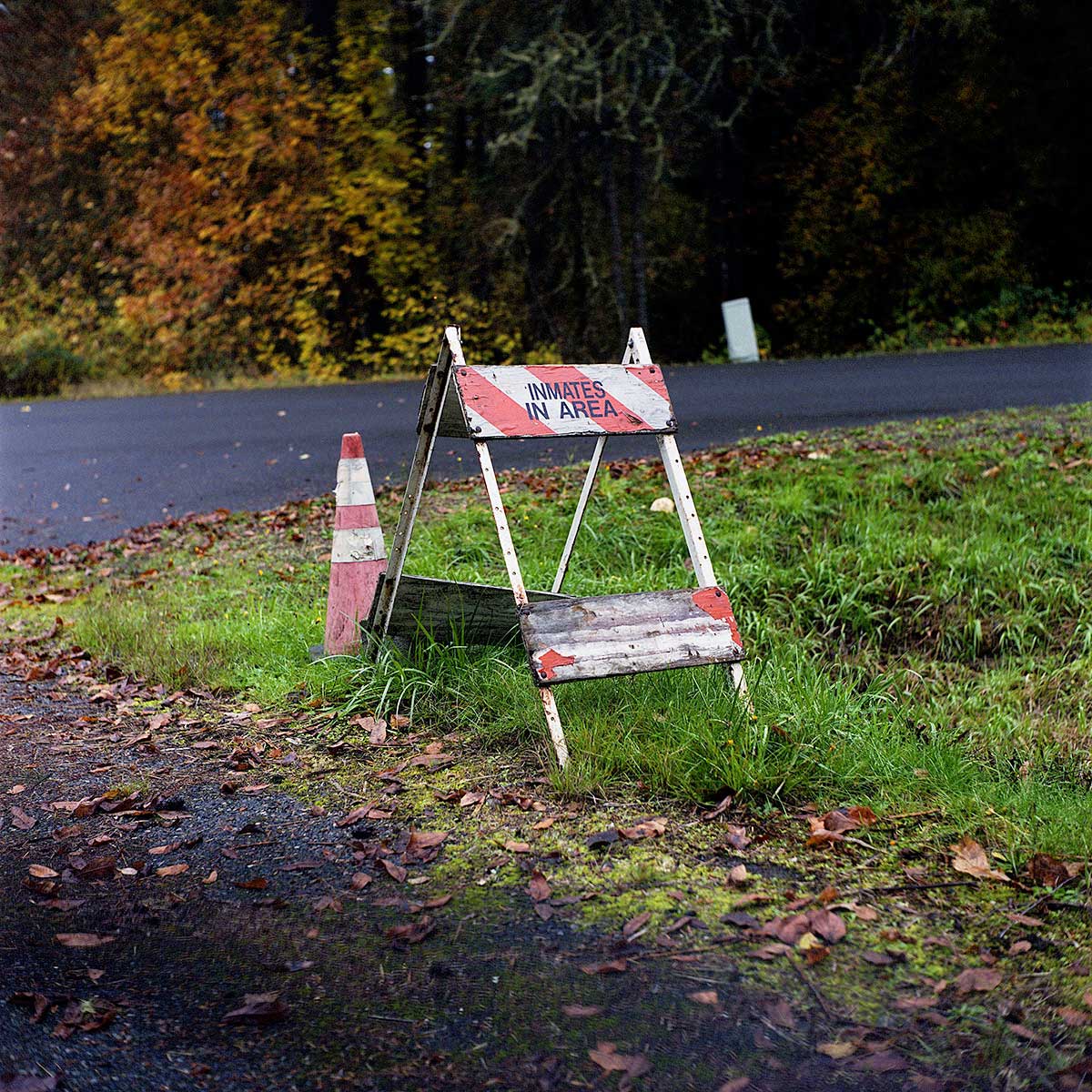 A sign off one of the main roads on McNeil Island alerting others to inmates in the area. Prisoners at other facilities routinely maintain remaining infrastructure on the island today.